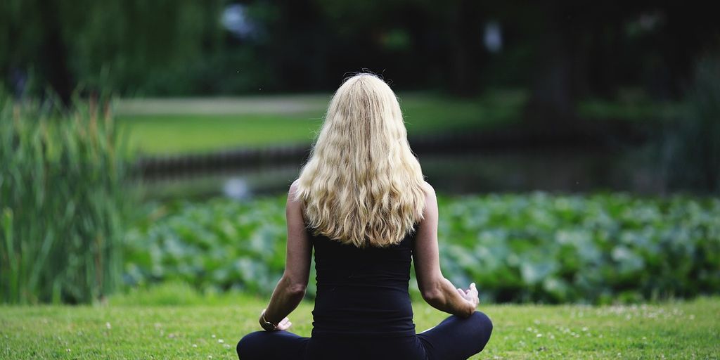 person practicing mindfulness through painting in a serene setting